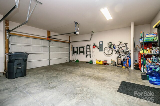 70 Cameo Dr, Flat Rock, NC 28731 - garage featuring a garage door opener and electric panel