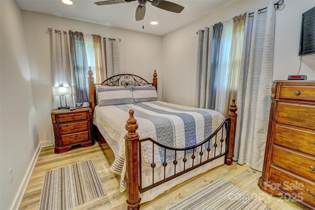 bedroom featuring baseboards, a ceiling fan, recessed lighting, and wood finished floors