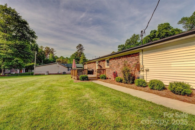 view of yard featuring a deck