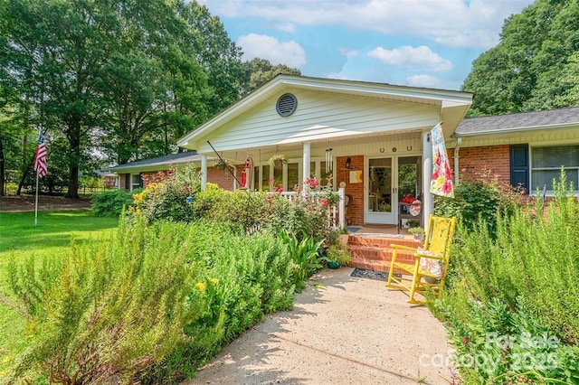 4805 Nesbit Rd, Monroe, NC 28112 - view of front of house featuring covered porch and brick siding