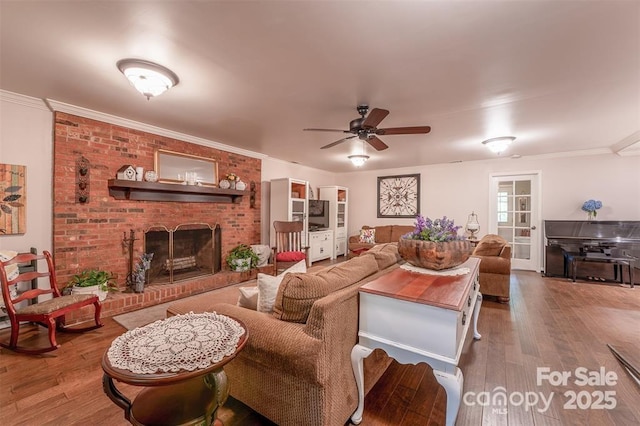 4805 Nesbit Rd, Monroe, NC 28112 - living room featuring crown molding, a ceiling fan, wood finished floors, and a fireplace