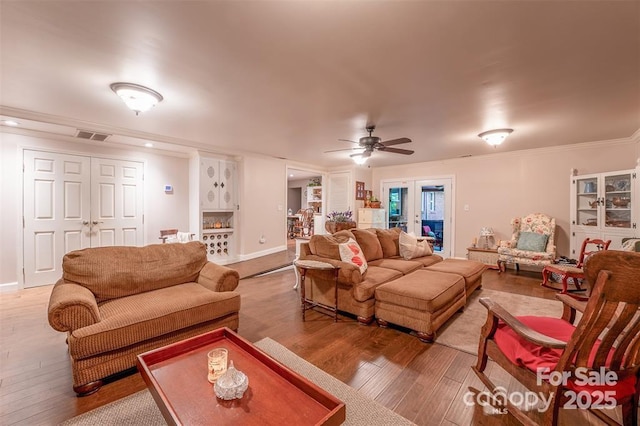 4805 Nesbit Rd, Monroe, NC 28112 - living area featuring crown molding, ceiling fan, visible vents, and hardwood / wood-style flooring