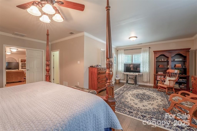 4805 Nesbit Rd, Monroe, NC 28112 - bedroom with crown molding, baseboards, wood finished floors, and visible vents