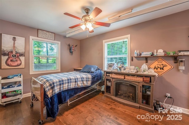 4805 Nesbit Rd, Monroe, NC 28112 - bedroom with baseboards, a ceiling fan, and wood finished floors