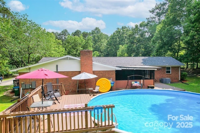 4805 Nesbit Rd, Monroe, NC 28112 - pool featuring a sunroom, a deck, and outdoor dining space