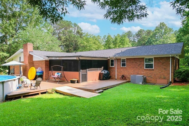 4805 Nesbit Rd, Monroe, NC 28112 - back of house with central air condition unit, brick siding, and a deck