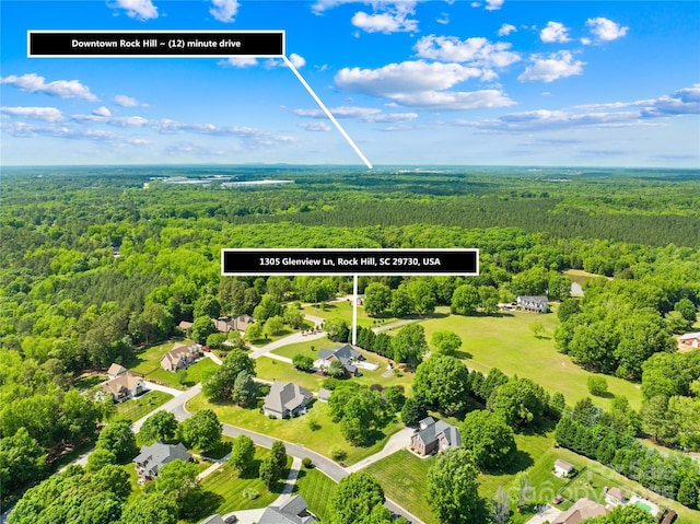 bird's eye view with a forest view