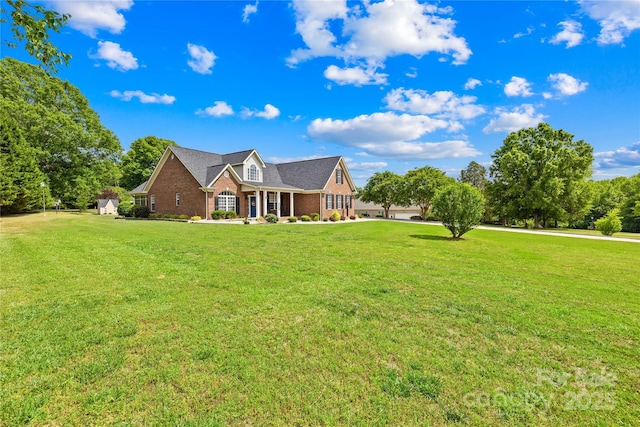 view of front of property with a front lawn and brick siding