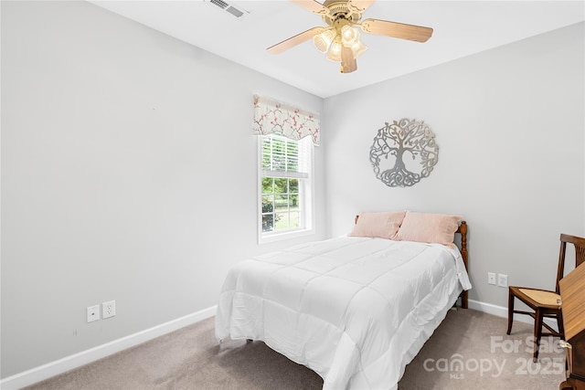 bedroom with carpet floors, baseboards, and ceiling fan