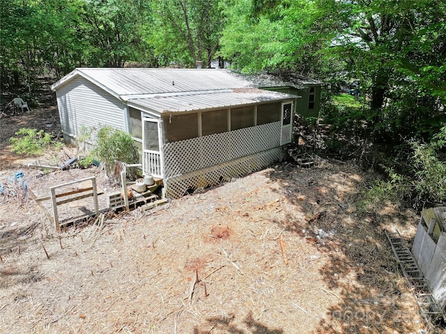 4585 Sunrise Beach Rd, Catawba, NC 28609 - back of house with a sunroom, metal roof, and entry steps