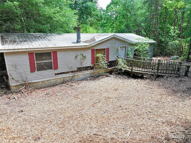 4585 Sunrise Beach Rd, Catawba, NC 28609 - single story home with a wooden deck and metal roof