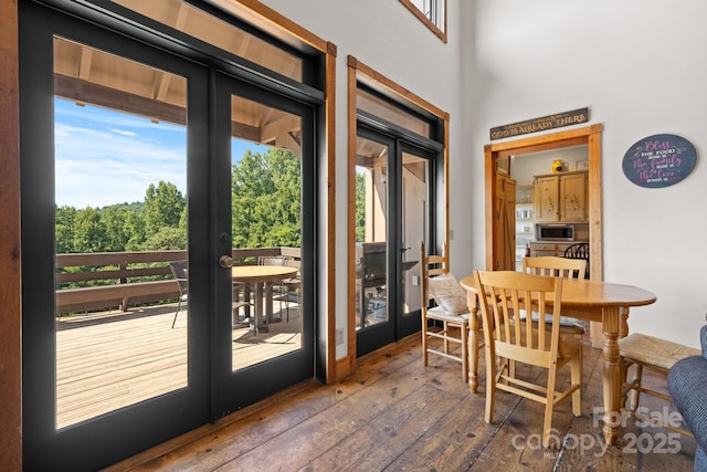 entryway featuring plenty of natural light, french doors, and hardwood / wood-style floors