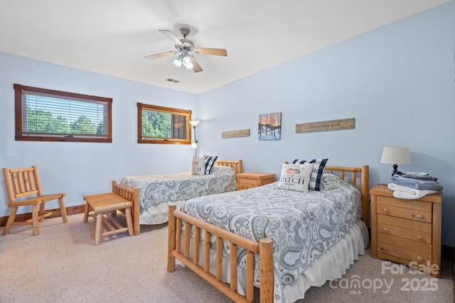 bedroom featuring a ceiling fan, baseboards, and visible vents