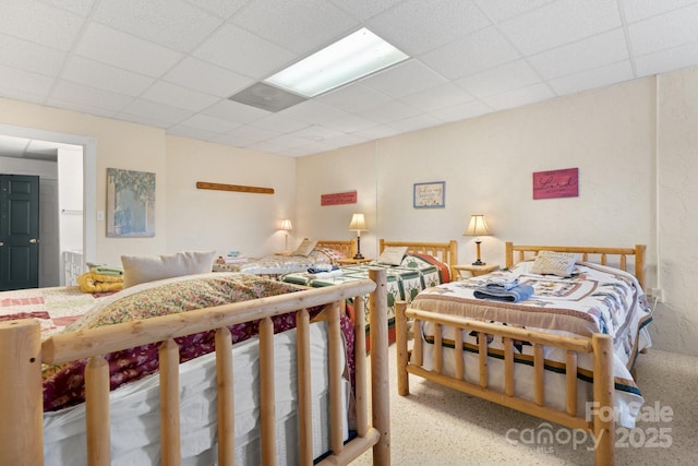 bedroom with a paneled ceiling