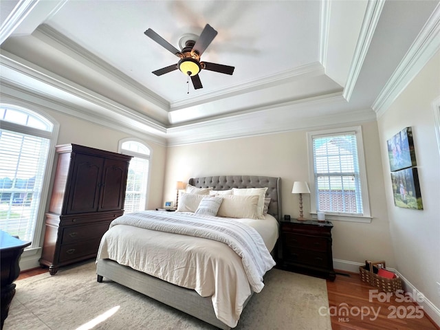 3000 J R Ct, Stanley, NC 28164 - bedroom featuring multiple windows, light wood finished floors, and a raised ceiling