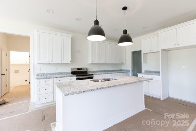 kitchen with light stone countertops, a sink, a kitchen island with sink, white cabinetry, and stainless steel electric stove