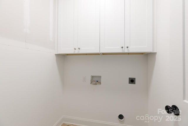 washroom with washer hookup, hookup for an electric dryer, baseboards, and cabinet space