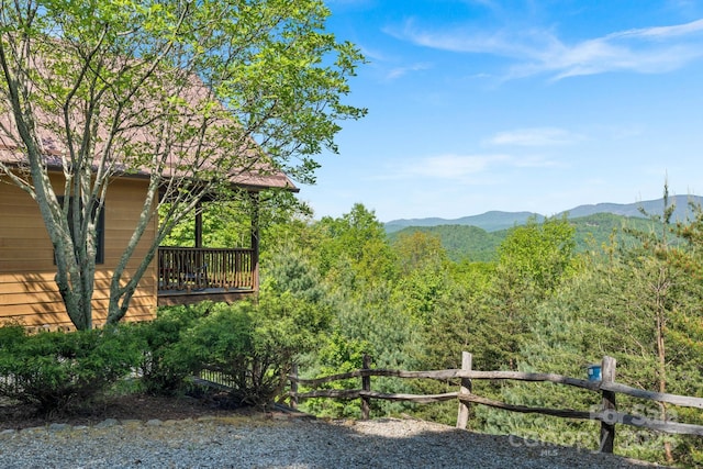 exterior space featuring a wooded view