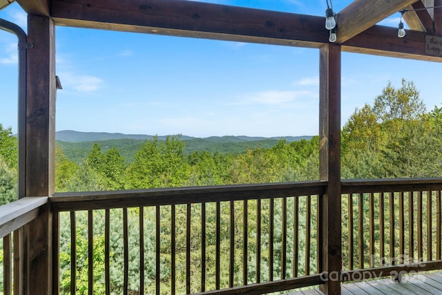 exterior space with a wooded view