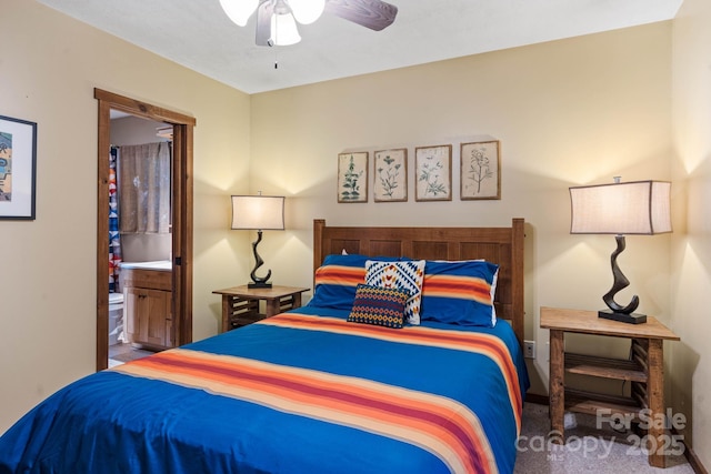 bedroom featuring carpet flooring, connected bathroom, and a ceiling fan