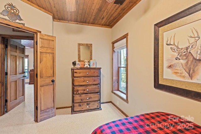 carpeted bedroom featuring wooden ceiling, baseboards, and ornamental molding