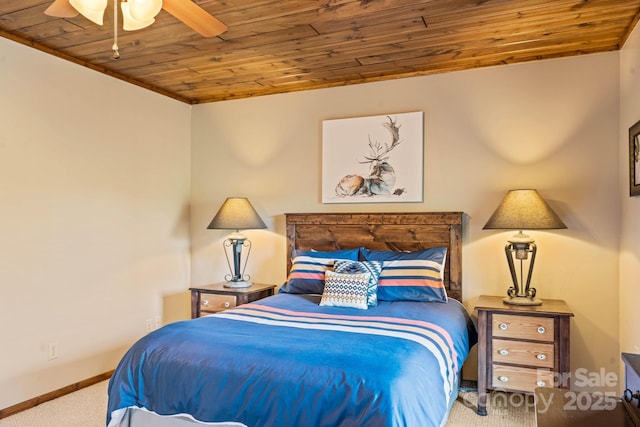 carpeted bedroom with baseboards, ceiling fan, and wood ceiling