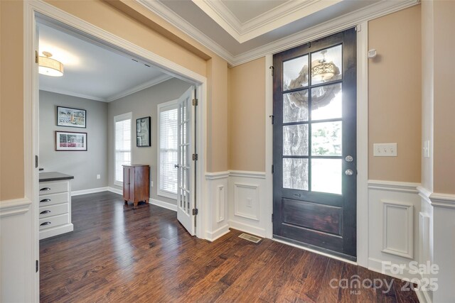 308 Hollister Estates Dr, Waxhaw, NC 28173 - entrance foyer with dark wood-style floors and ornamental molding