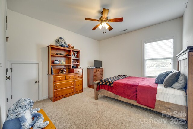 308 Hollister Estates Dr, Waxhaw, NC 28173 - bedroom with light carpet and a ceiling fan