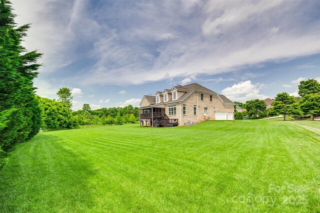 308 Hollister Estates Dr, Waxhaw, NC 28173 - view of green lawn with an attached garage and a wooden deck