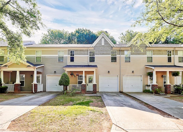5943 Pisgah Way, Charlotte, NC 28217 - multi unit property with covered porch, an attached garage, and driveway