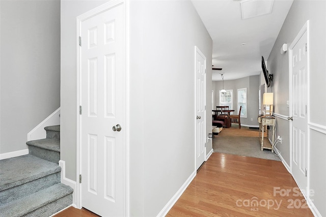 5943 Pisgah Way, Charlotte, NC 28217 - corridor featuring baseboards, light wood-type flooring, and stairs