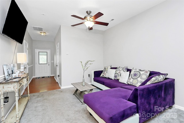 5943 Pisgah Way, Charlotte, NC 28217 - living area with carpet floors, a ceiling fan, baseboards, and visible vents