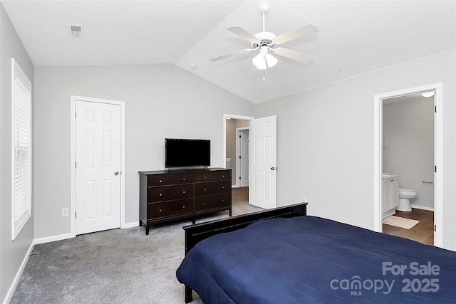 5943 Pisgah Way, Charlotte, NC 28217 - bedroom featuring visible vents, baseboards, ensuite bathroom, a ceiling fan, and vaulted ceiling