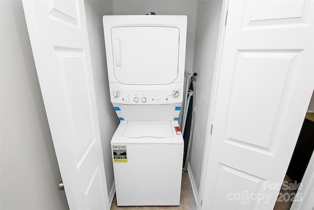5943 Pisgah Way, Charlotte, NC 28217 - washroom with baseboards, laundry area, and stacked washer / dryer