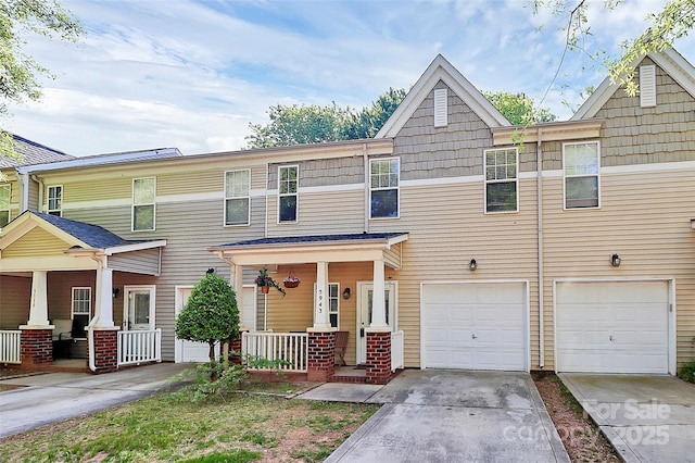 5943 Pisgah Way, Charlotte, NC 28217 - view of property with a porch, an attached garage, and concrete driveway