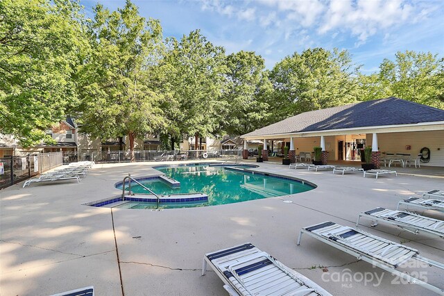5943 Pisgah Way, Charlotte, NC 28217 - pool featuring a patio, fence, and a community hot tub