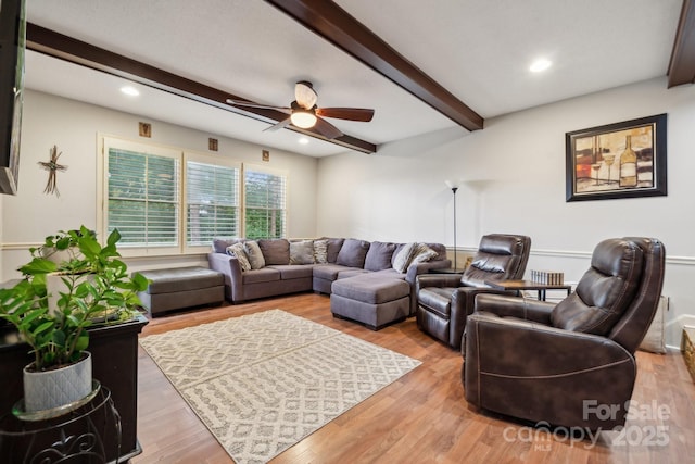 living room featuring ceiling fan, beamed ceiling, recessed lighting, and wood finished floors