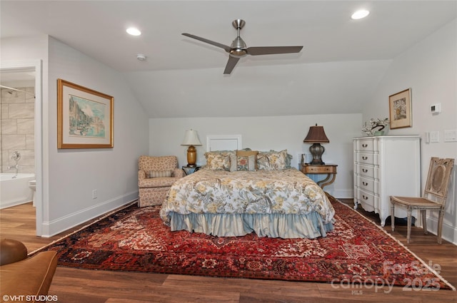 bedroom with wood finished floors and lofted ceiling