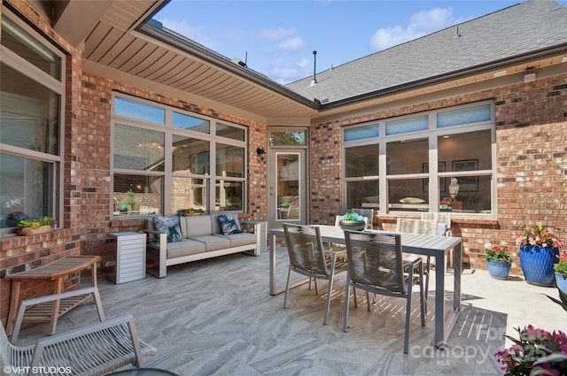 view of patio with outdoor lounge area and outdoor dining space