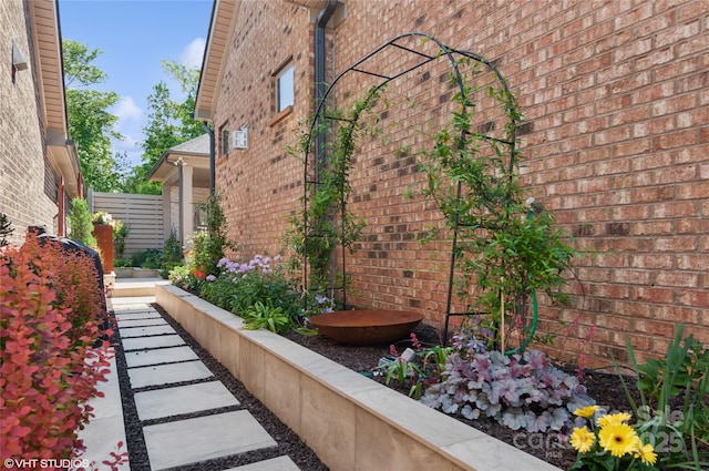 view of side of home featuring brick siding