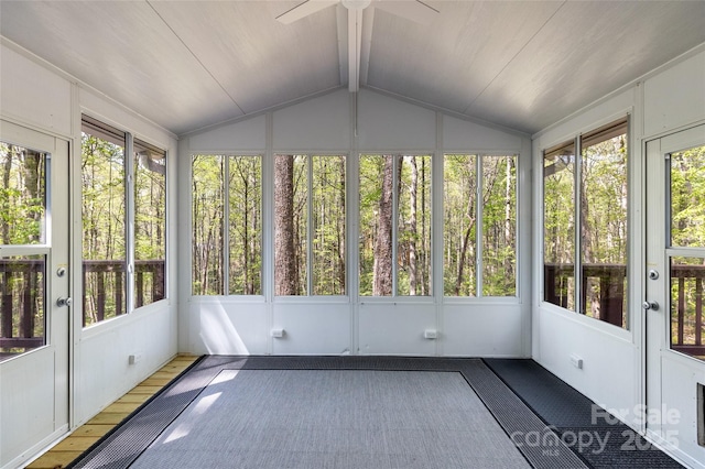 unfurnished sunroom featuring ceiling fan