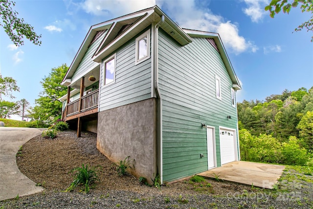 18 Benzington Way, Leicester, NC 28748 - view of home's exterior featuring a garage and concrete driveway