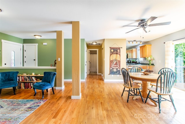 18 Benzington Way, Leicester, NC 28748 - dining room featuring light wood finished floors, ceiling fan, and baseboards