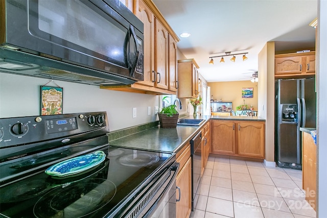 18 Benzington Way, Leicester, NC 28748 - kitchen featuring black appliances, rail lighting, a sink, light tile patterned floors, and ceiling fan