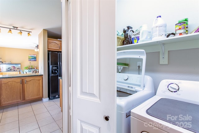 18 Benzington Way, Leicester, NC 28748 - laundry area featuring washing machine and clothes dryer, light tile patterned floors, rail lighting, and a ceiling fan