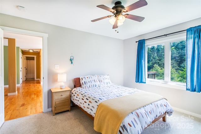 18 Benzington Way, Leicester, NC 28748 - bedroom with baseboards, light carpet, and a ceiling fan