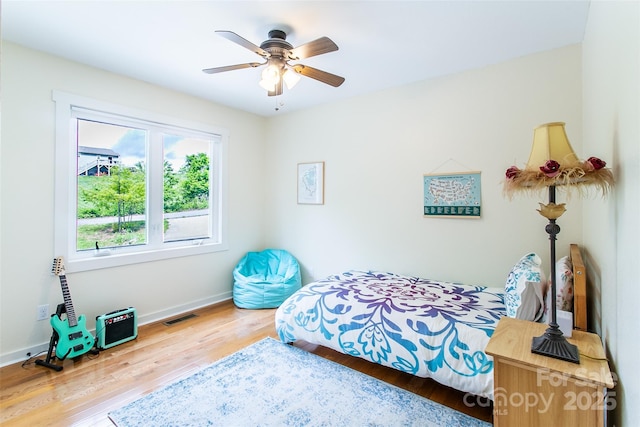 18 Benzington Way, Leicester, NC 28748 - bedroom featuring wood finished floors, baseboards, and a ceiling fan
