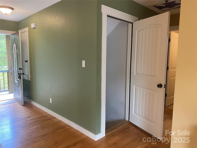 18 Benzington Way, Leicester, NC 28748 - corridor with wood finished floors, healthy amount of natural light, and baseboards