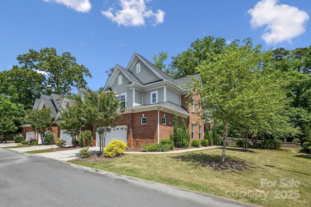 907 Ospre Ln, Fort Mill, SC 29708 - view of front facade featuring concrete driveway, a garage, a front lawn, and brick siding