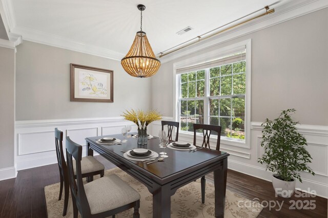 907 Ospre Ln, Fort Mill, SC 29708 - dining area with a chandelier, crown molding, a wainscoted wall, and visible vents